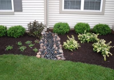 Project Gallery - Landscape Downspout River Rock Bed Installation