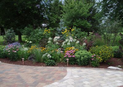 Design and install berm and hardscape features.