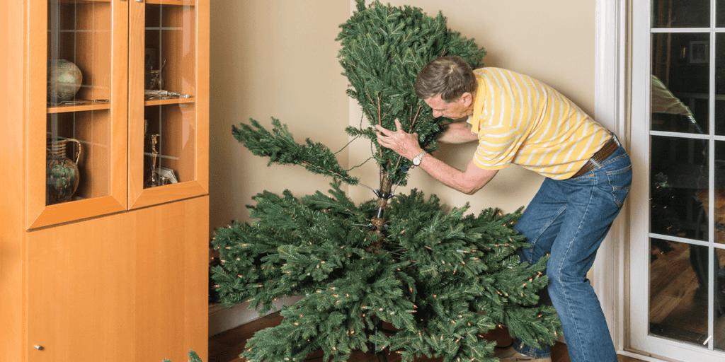 Platt Hill Nursery-man setting up Christmas tree