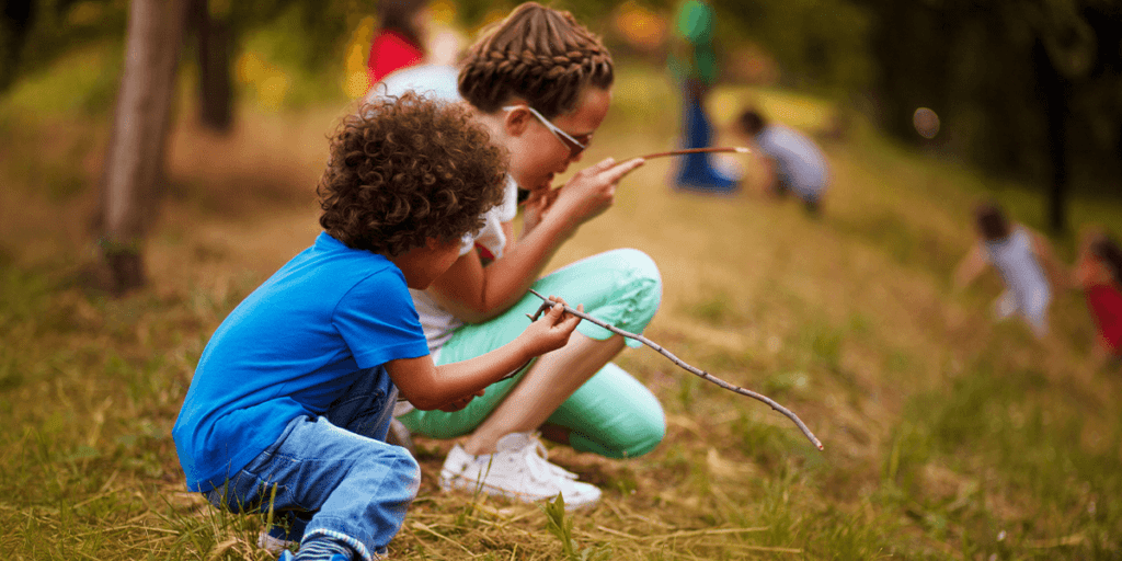 Platt Hill Nursery - Nature Scavenger Walk Chicago - Children looking at sticks