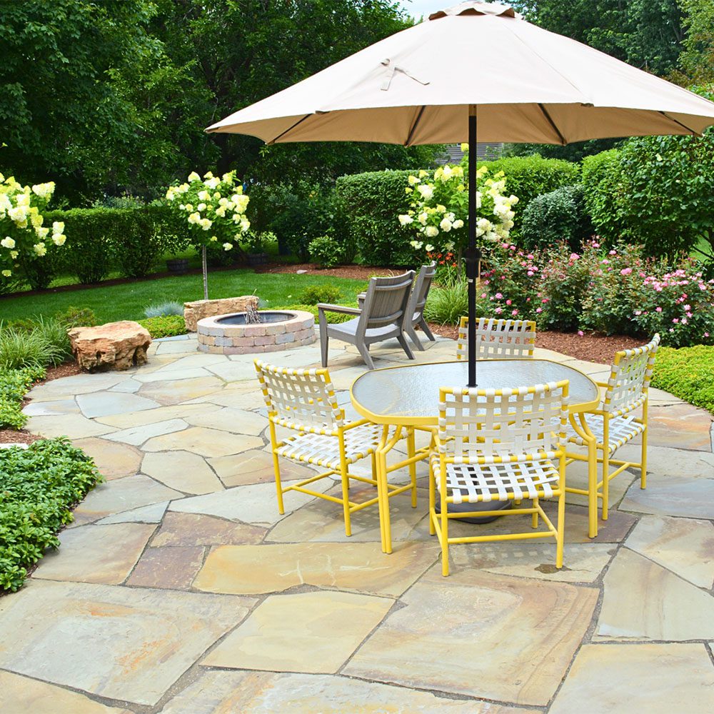 Landscape Redesign of Backyard with stone patio