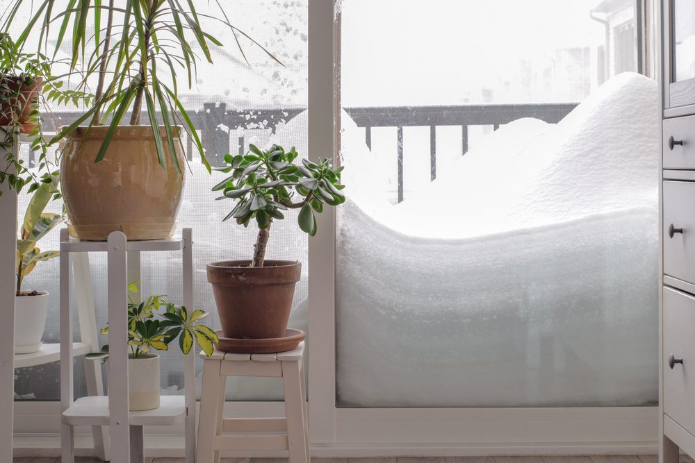 a huge pile of snow on a balcony